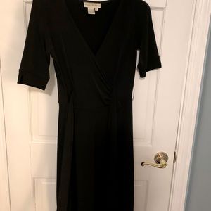 Black elbow sleeve  wrap dress. Tie waist